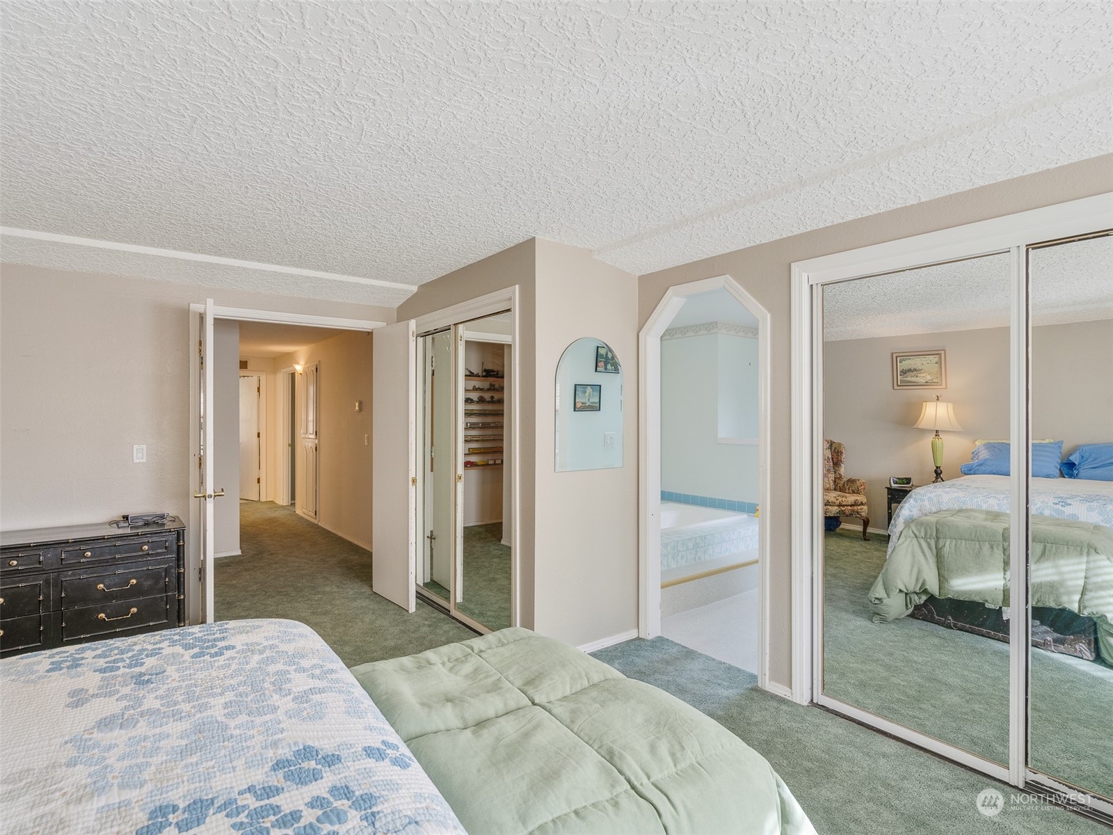 5814 Northwest 169th Street Ridgefield, WA 98642 - Photo 19 of 40 a bedroom with a bed and a large mirror