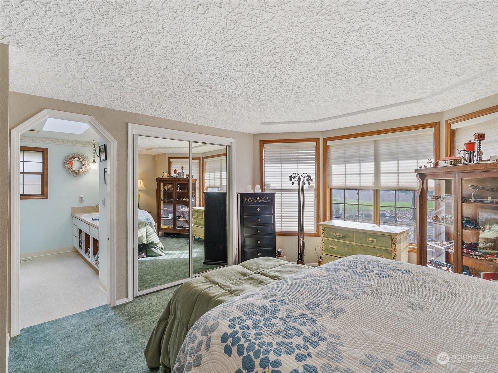 5814 Northwest 169th Street Ridgefield, WA 98642 - Photo 20 of 40 a bedroom with a bed and large window