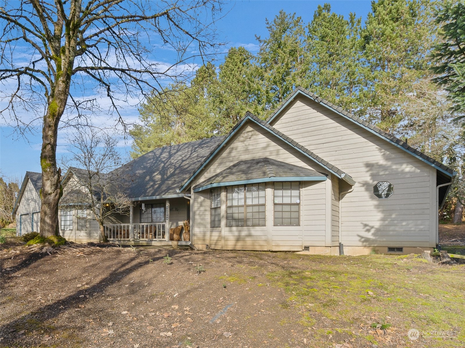 5814 Northwest 169th Street Ridgefield, WA 98642 - Photo 2 of 40 a front view of a house with a garden