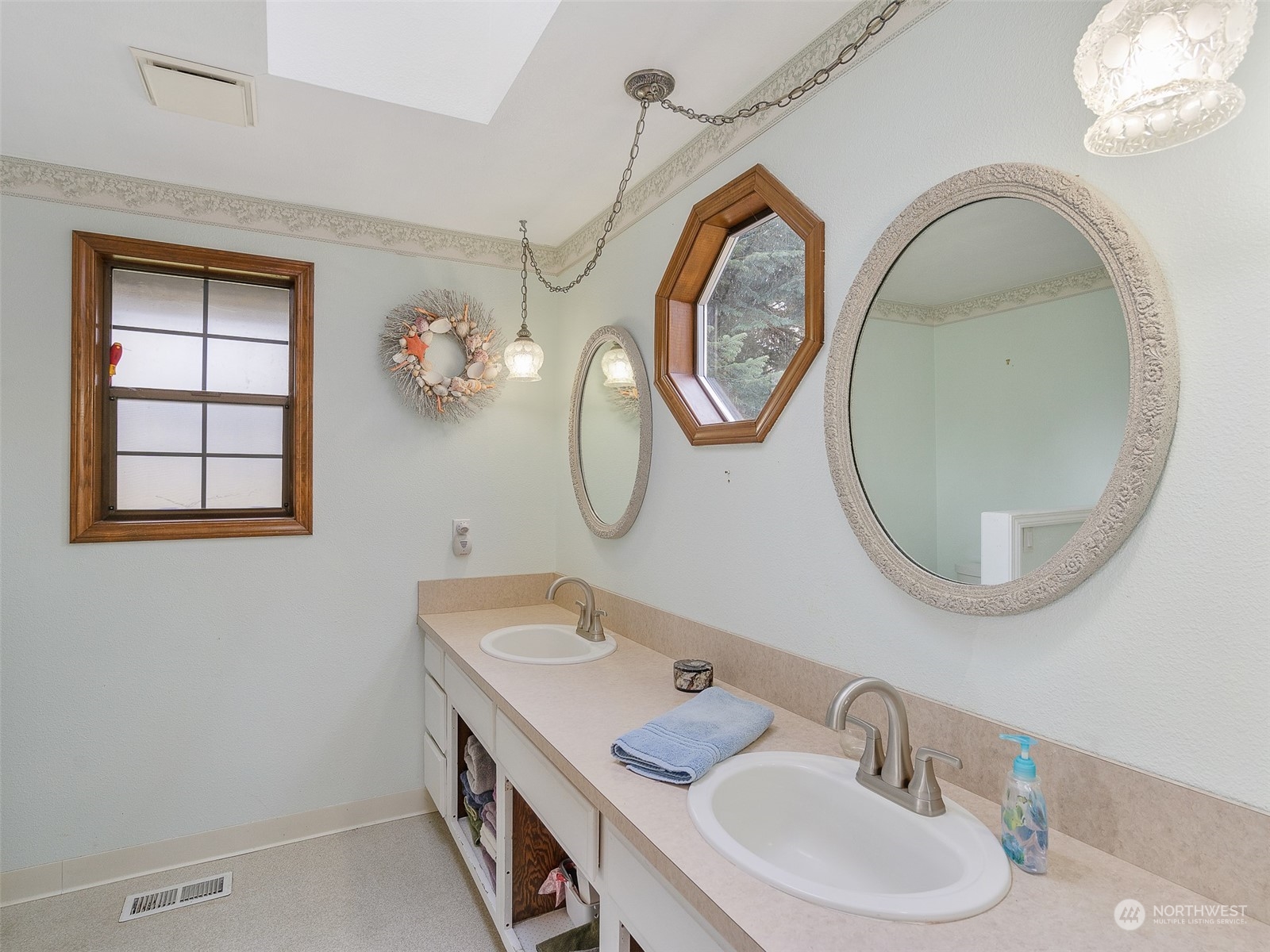 5814 Northwest 169th Street Ridgefield, WA 98642 - Photo 22 of 40 a bathroom with a sink and a mirror