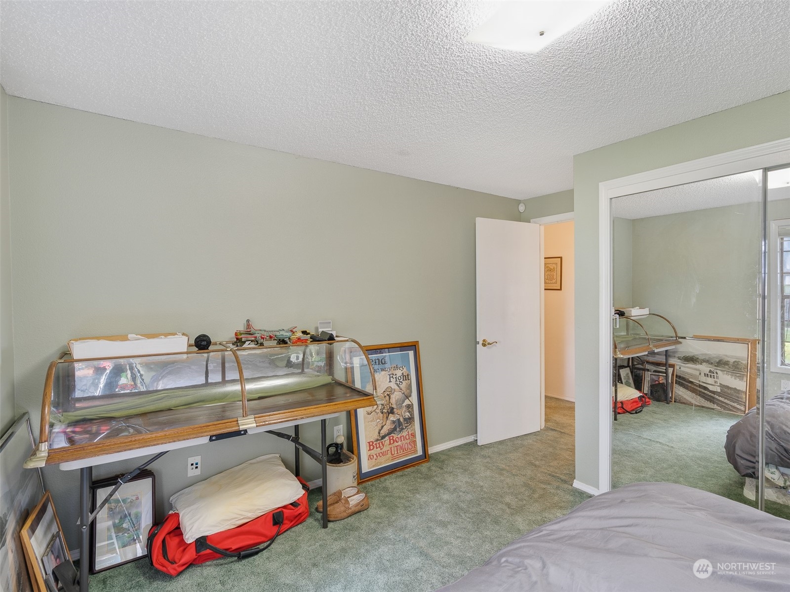 5814 Northwest 169th Street Ridgefield, WA 98642 - Photo 24 of 40 a bedroom with a bed and closet