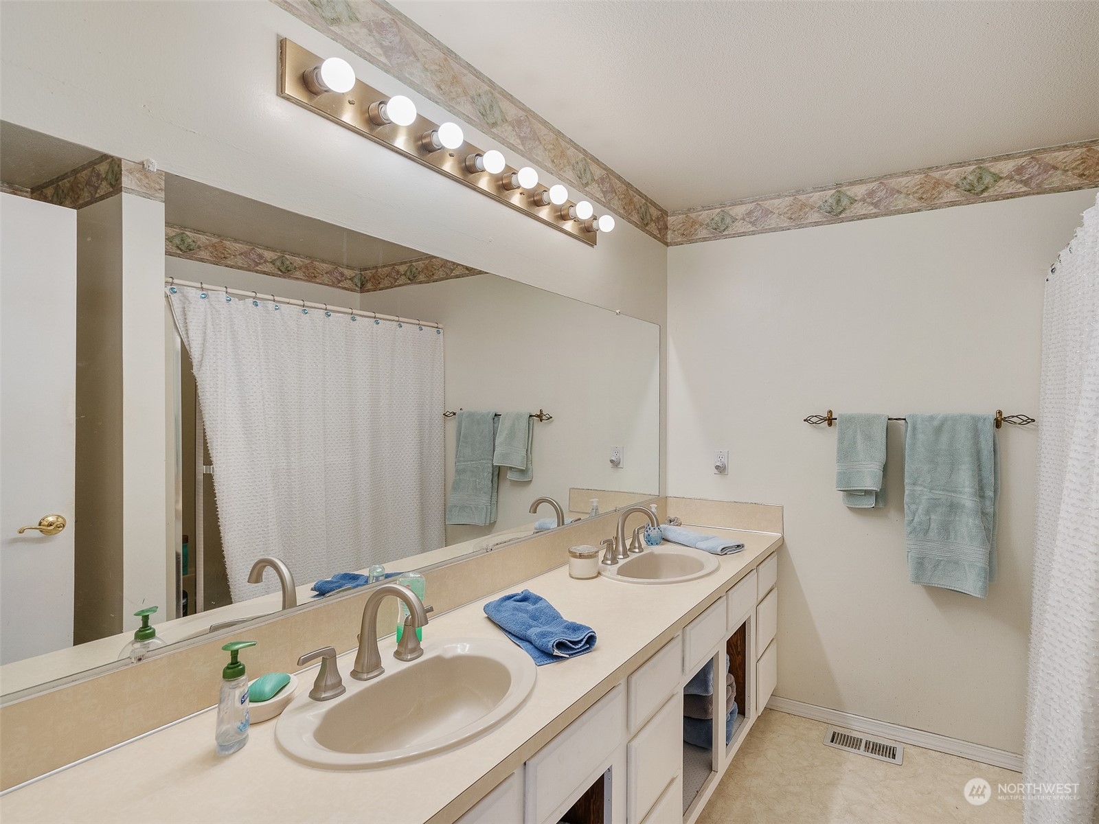 5814 Northwest 169th Street Ridgefield, WA 98642 - Photo 26 of 40 a bathroom with a sink double vanity and a mirror