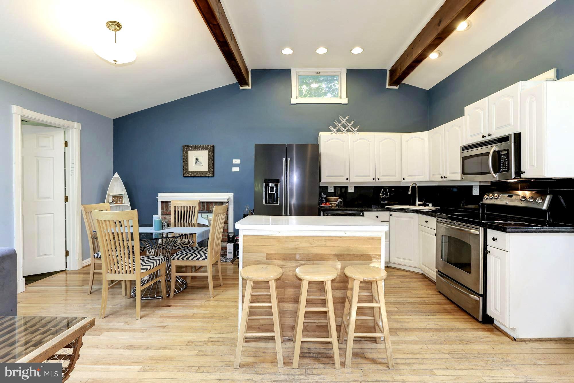 1885 Severn Grove Road Annapolis, MD 21401 - Photo 10 of 30 Dining Area and Kitchen Island Dining Bar