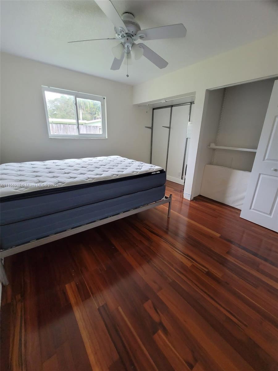 8425 Southwest 185th Street Cutler Bay, FL 33157 - Photo 15 of 17 a spacious bedroom with a bed and a window