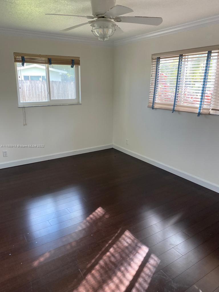 8425 Southwest 185th Street Cutler Bay, FL 33157 - Photo 16 of 17 a view of room with hardwood floor and window