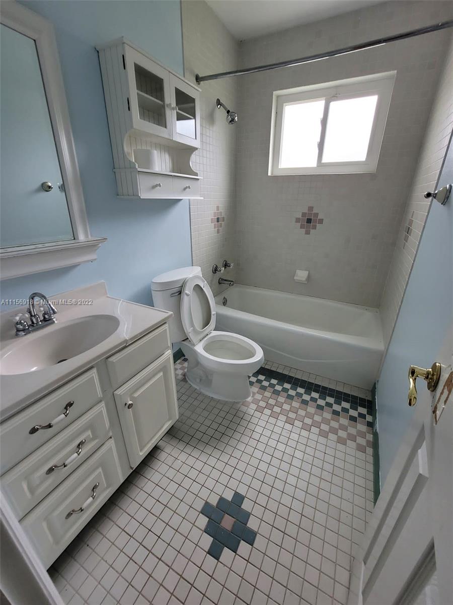 8425 Southwest 185th Street Cutler Bay, FL 33157 - Photo 17 of 17 a bathroom with a sink a toilet and shower