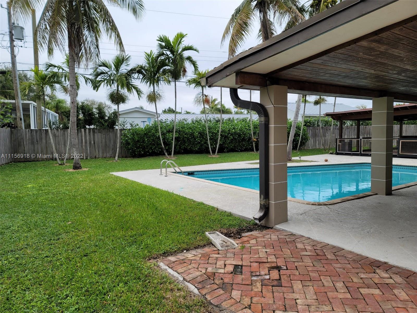 8425 Southwest 185th Street Cutler Bay, FL 33157 - Photo 3 of 17 a view of a backyard with a garden