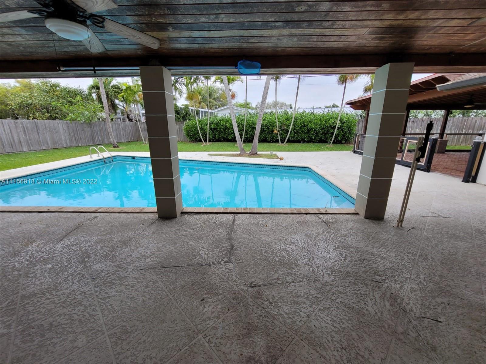8425 Southwest 185th Street Cutler Bay, FL 33157 - Photo 4 of 17 a view of swimming pool with a yard