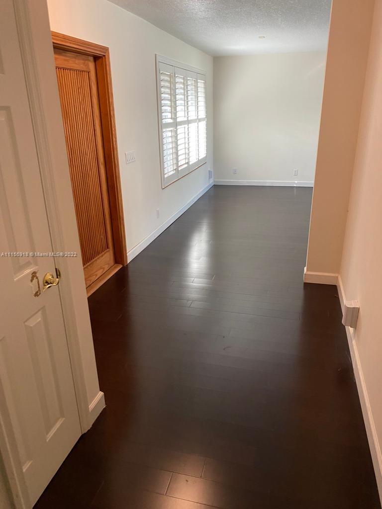 8425 Southwest 185th Street Cutler Bay, FL 33157 - Photo 8 of 17 an empty room with windows