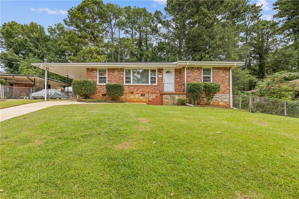 3133 Pinehill Drive Decatur, GA 30032 - Photo 1 of 1 front view of a house with a yard