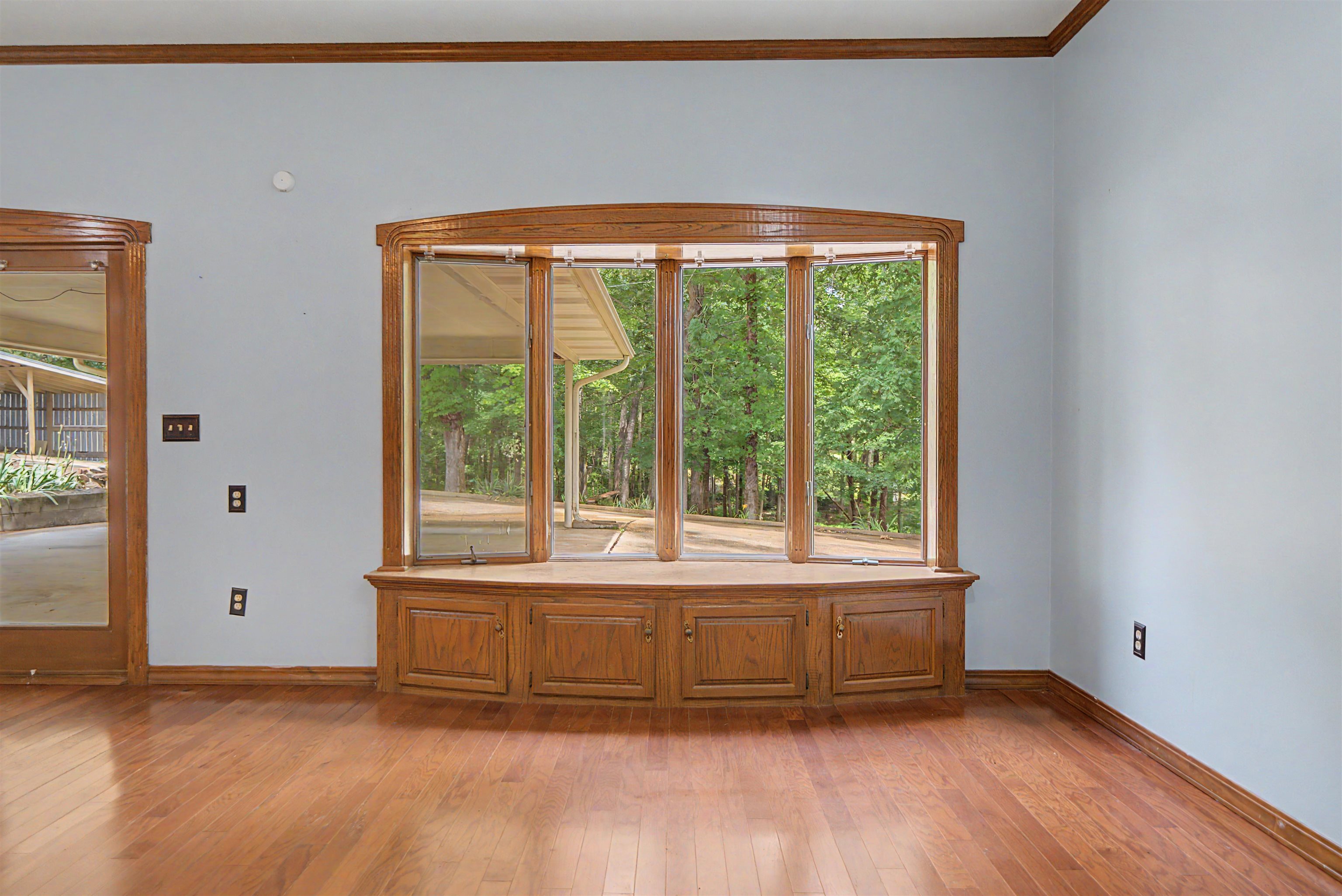 436 Skyline Road Selmer, TN 38375 - Photo 32 of 40 Bay window with integrated storage cabinetry and wood-finish flooring