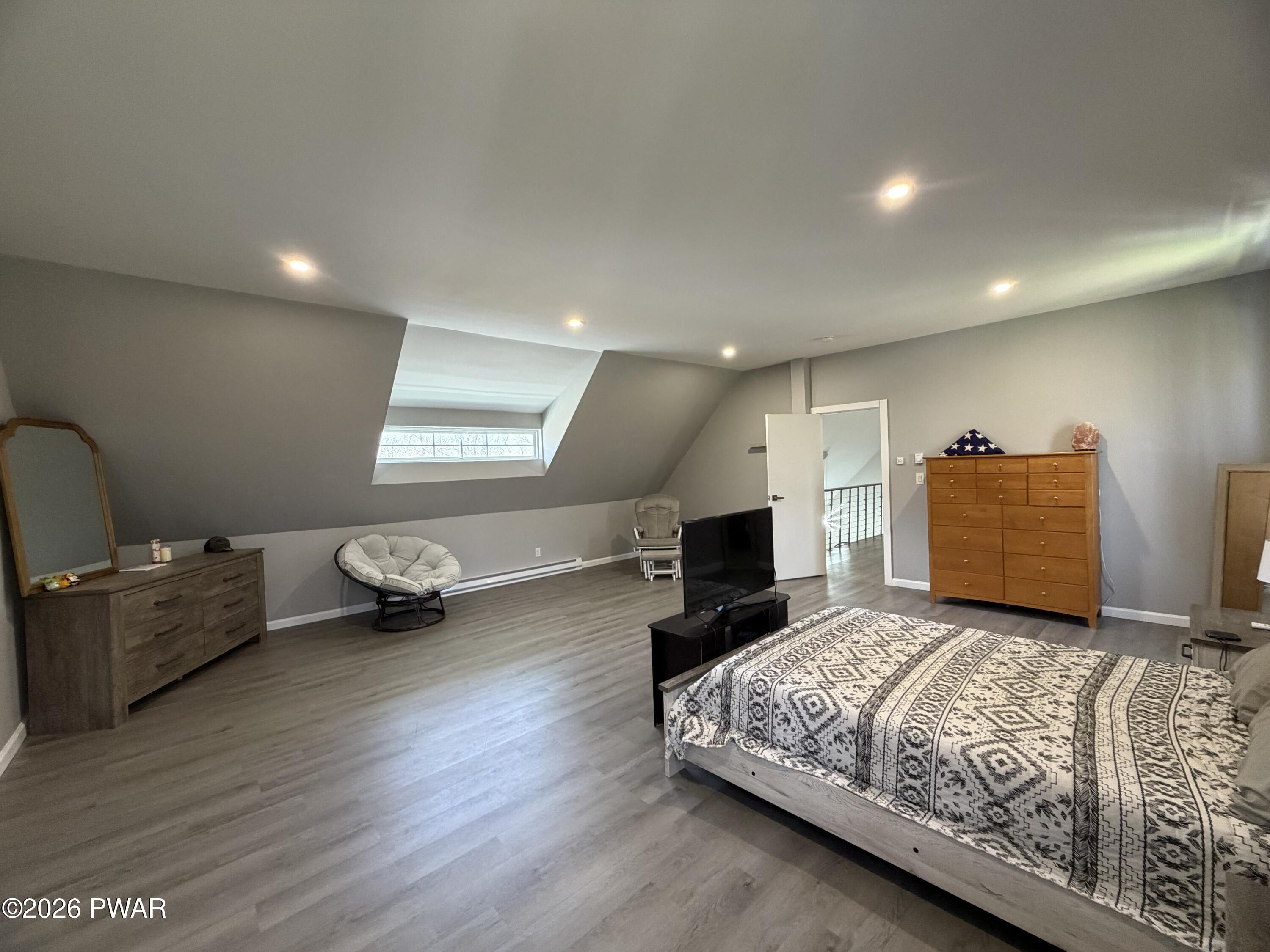 801 Maple Ridge Court Hawley, PA 18428 - Photo 50 of 55 a living room with furniture and a flat screen tv