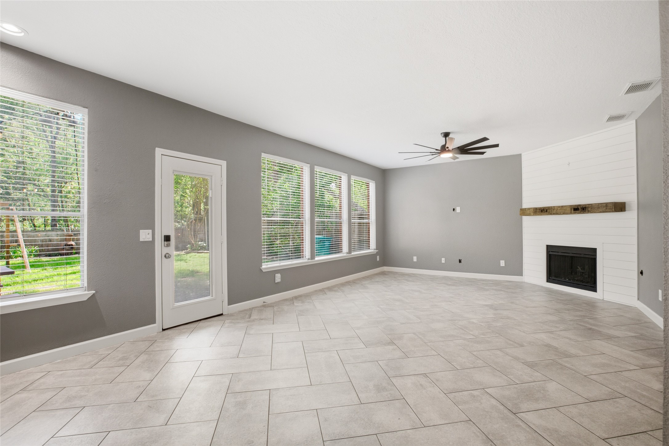 20907 Nettlebrook Lane Katy, TX 77450 - Photo 17 of 46 Windows pull in the backyard views, and the door leading outside keeps everything within reach.
