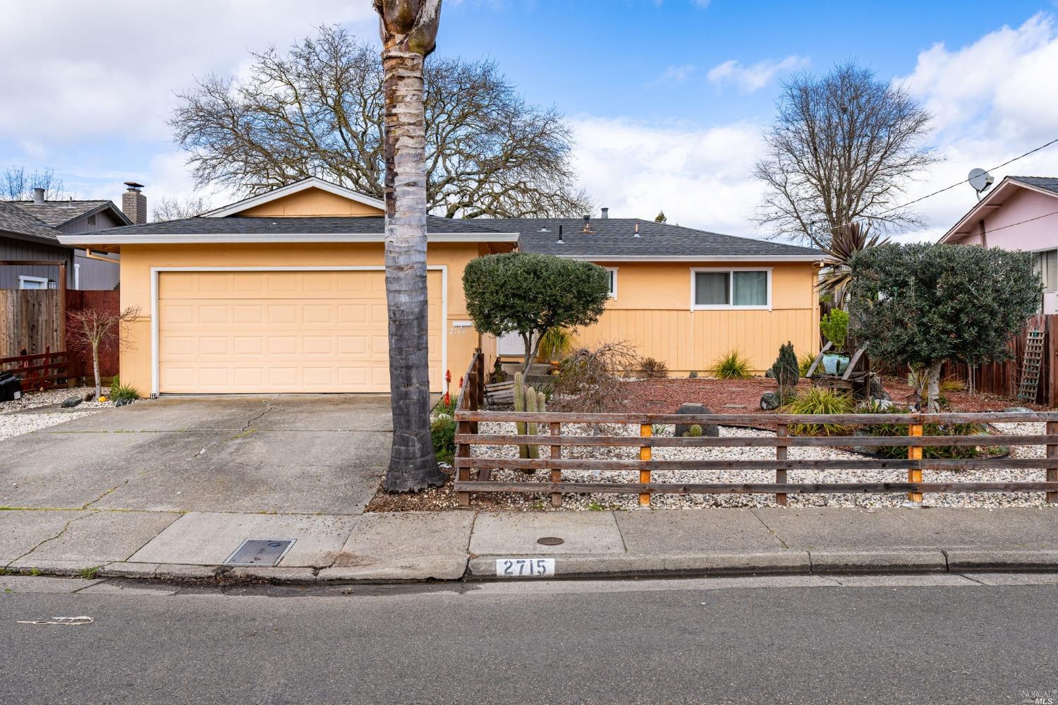 2715 Aztec Street Santa Rosa, CA 95403 - Photo 1 of 35 a view of a house with a yard and garage