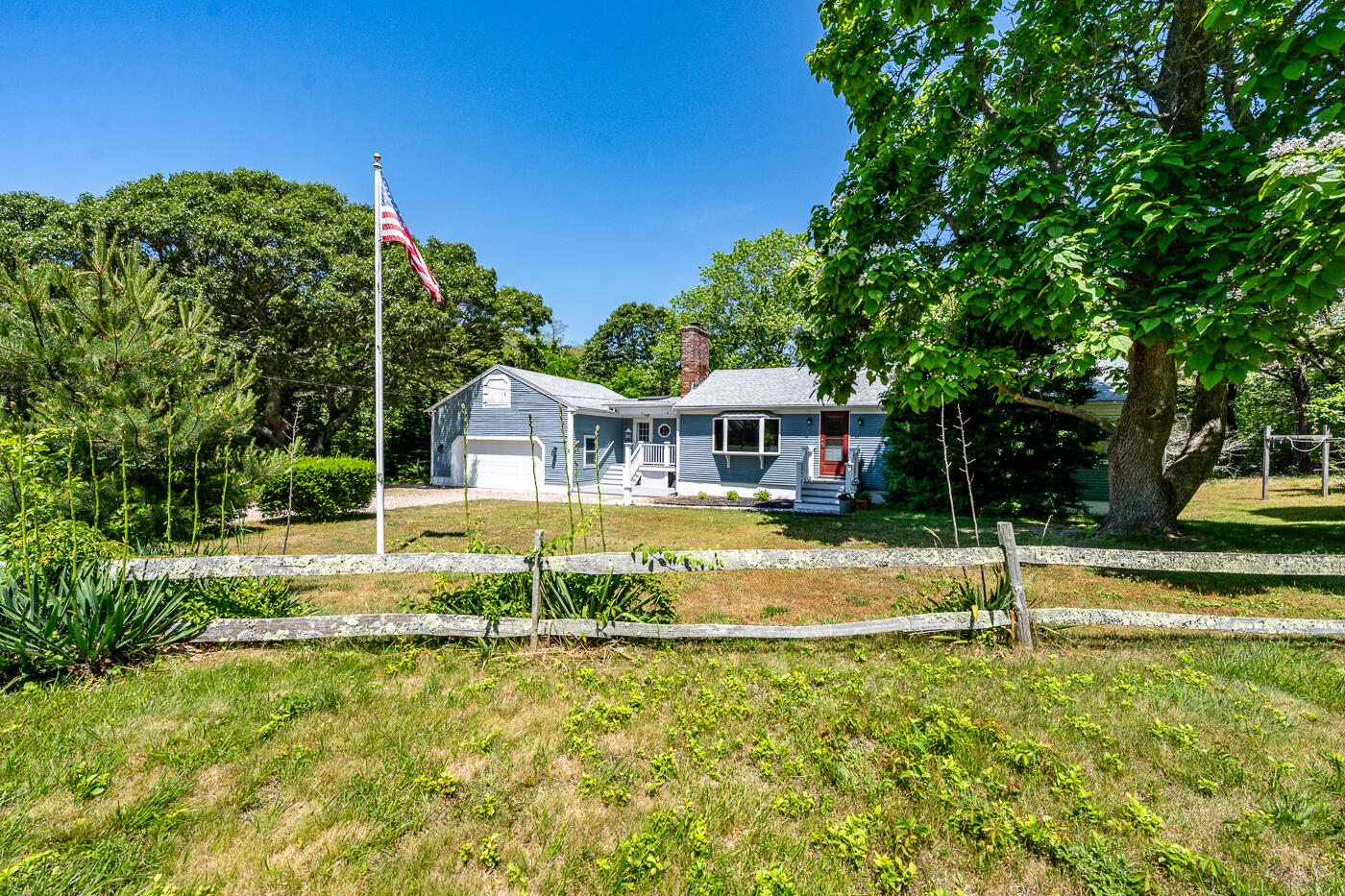 2 Pine Ridge End Truro, MA 02666 - Photo 3 of 31 a front view of a house with a yard