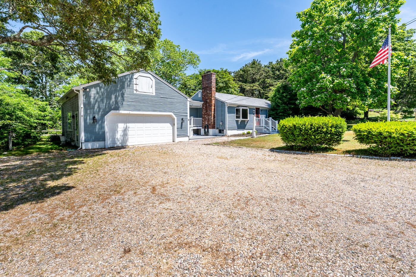 2 Pine Ridge End Truro, MA 02666 - Photo 6 of 31 a front view of a house with a garden and yard