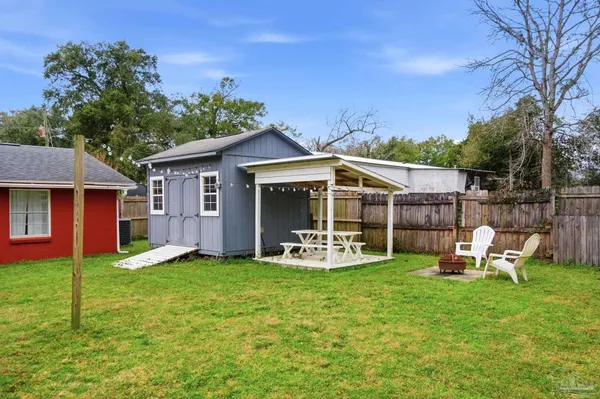 a view of a house with a yard porch and sitting area