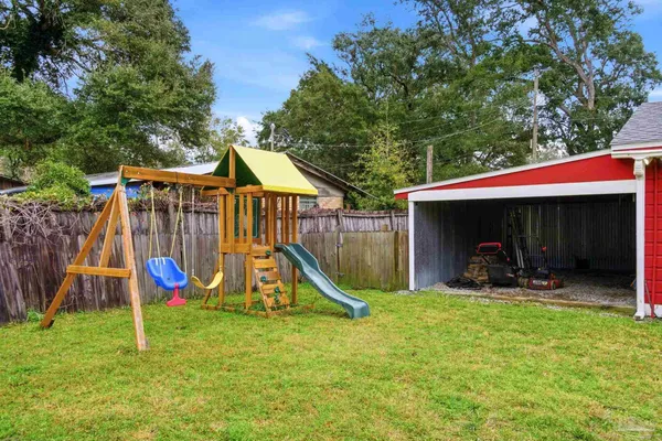a backyard of a house with seating space