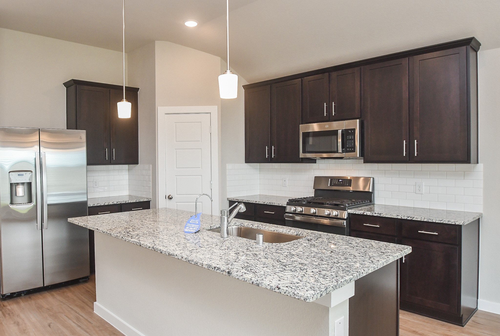2007 Live Springs Way Rosenberg, TX 77471 - Photo 11 of 25 Beautiful island kitchen with refridgerator included!