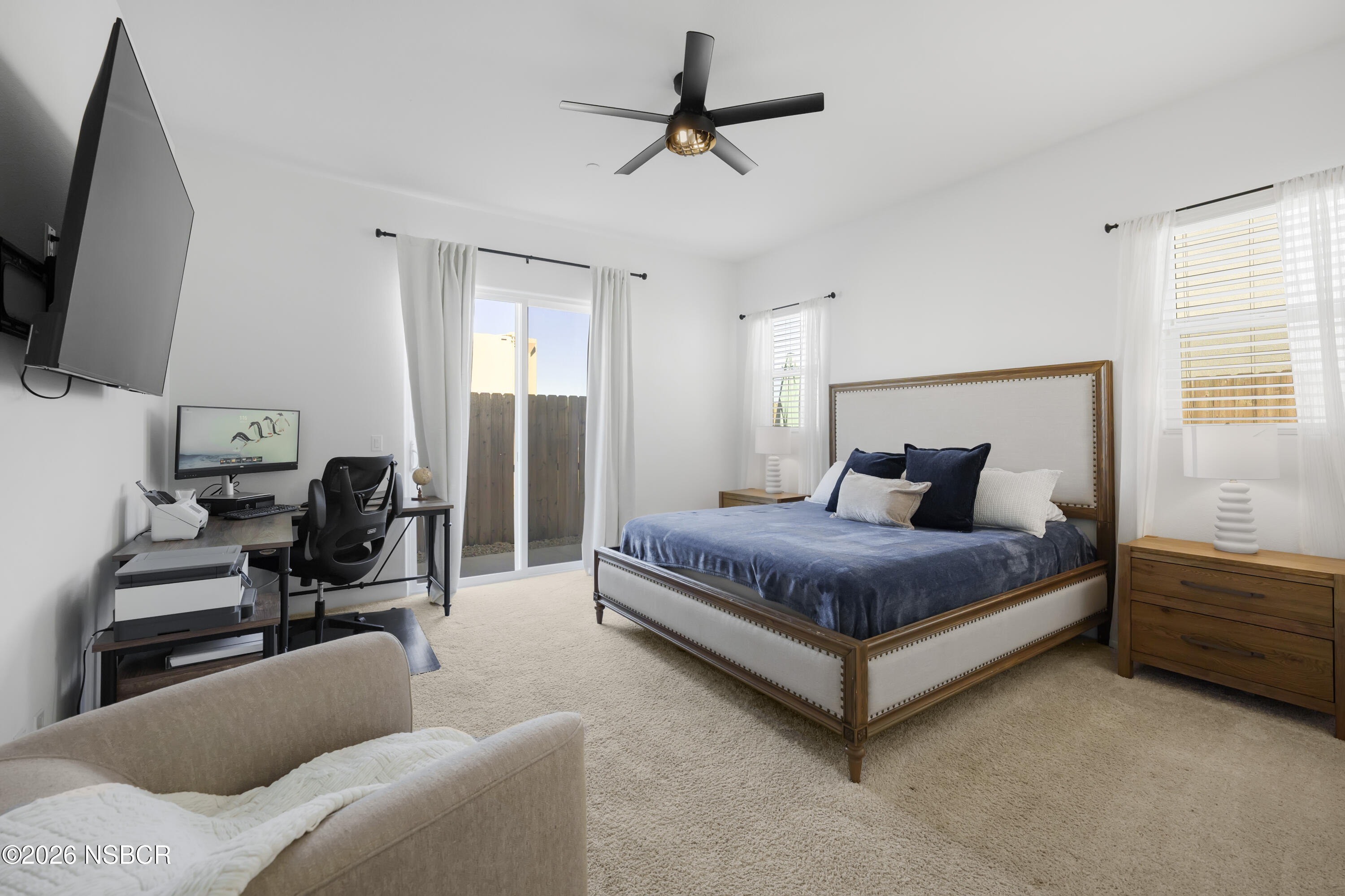 751 Skyview Lane Santa Maria, CA 93455 - Photo 22 of 31 a bedroom with a bed couch and a flat tv screen