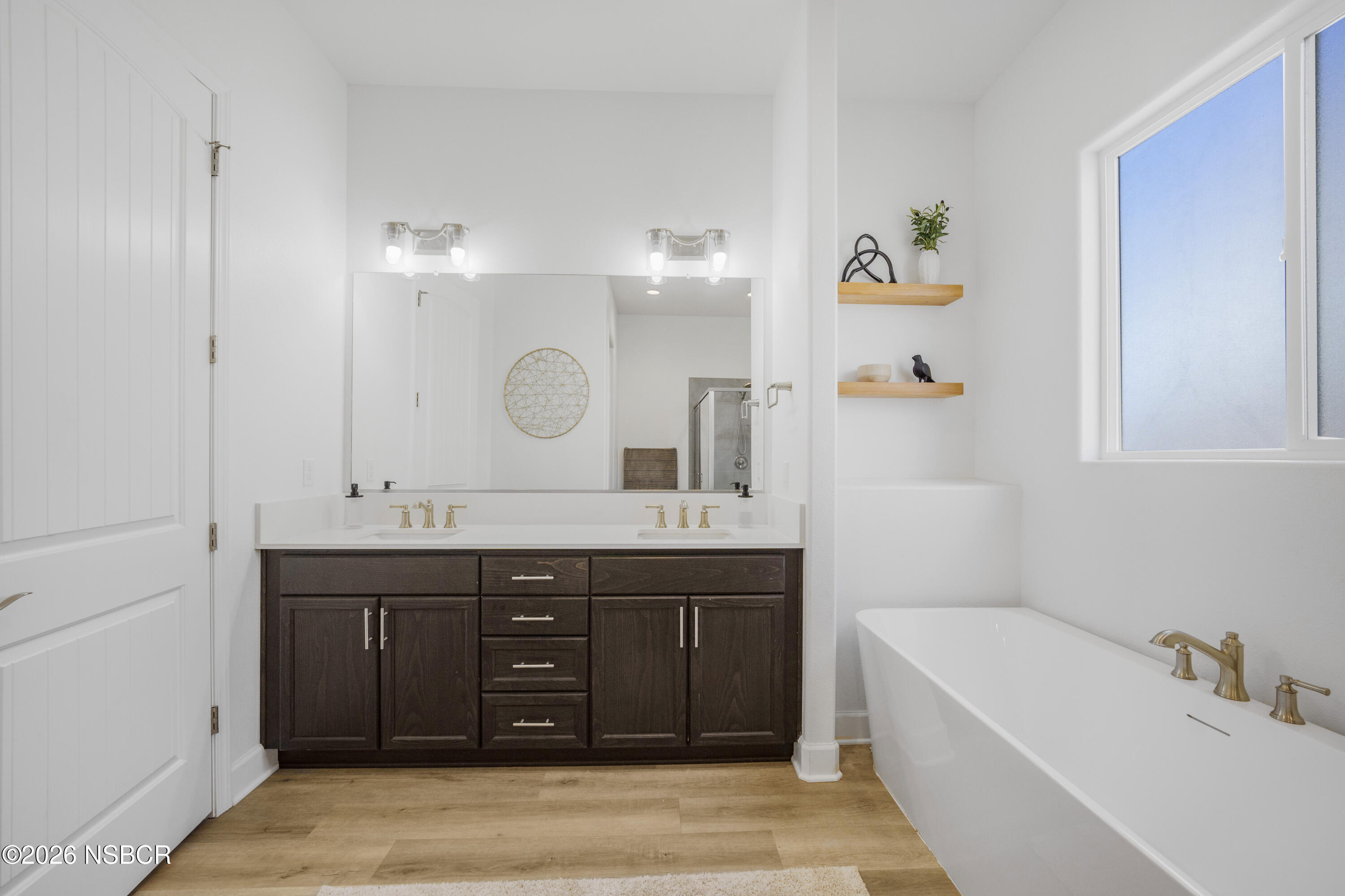 751 Skyview Lane Santa Maria, CA 93455 - Photo 24 of 31 a spacious bathroom with a granite countertop sink a bathtub a mirror and vanity