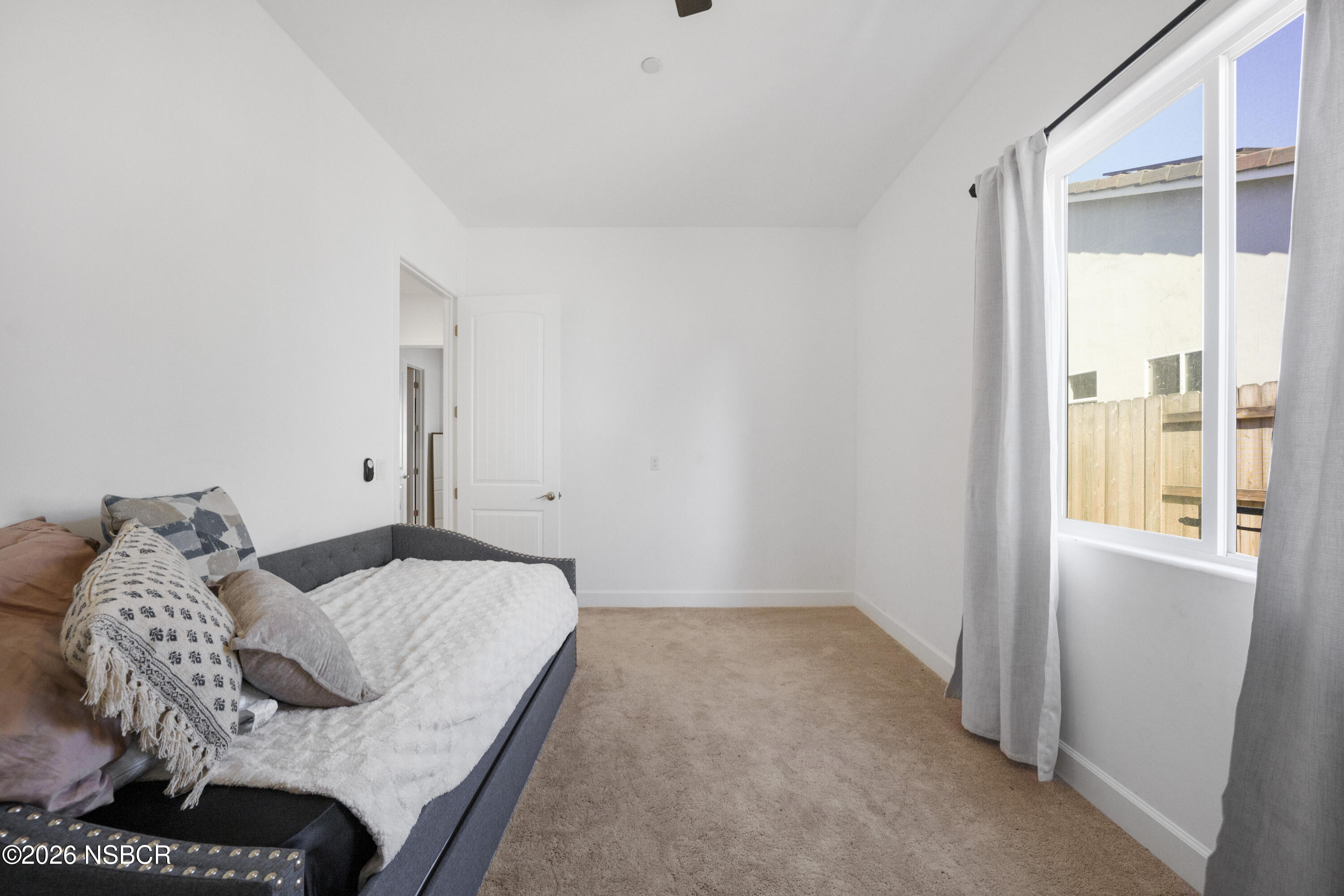 751 Skyview Lane Santa Maria, CA 93455 - Photo 27 of 31 a bedroom with a bed and a window