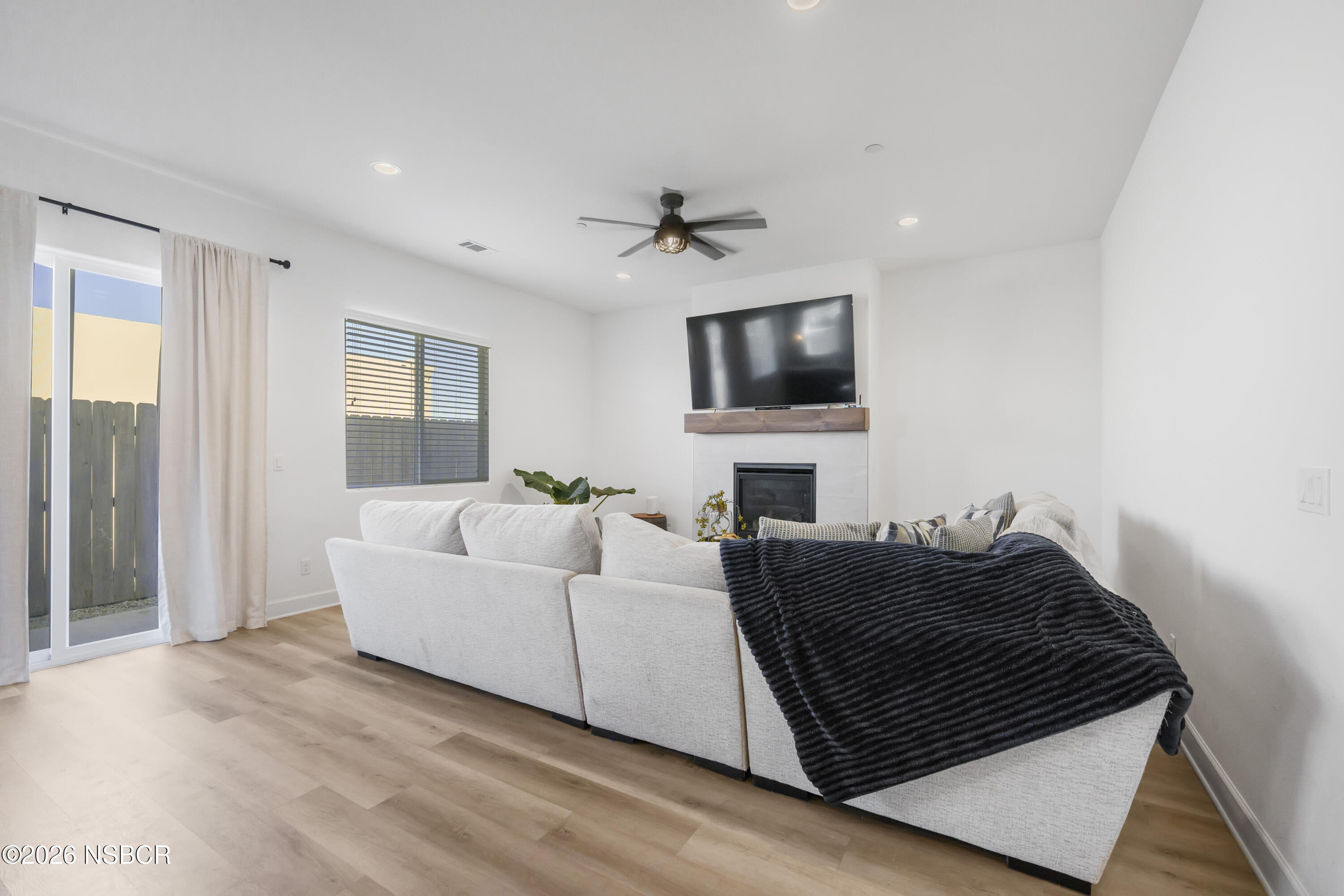 751 Skyview Lane Santa Maria, CA 93455 - Photo 4 of 31 a living room with a couch and a flat screen tv