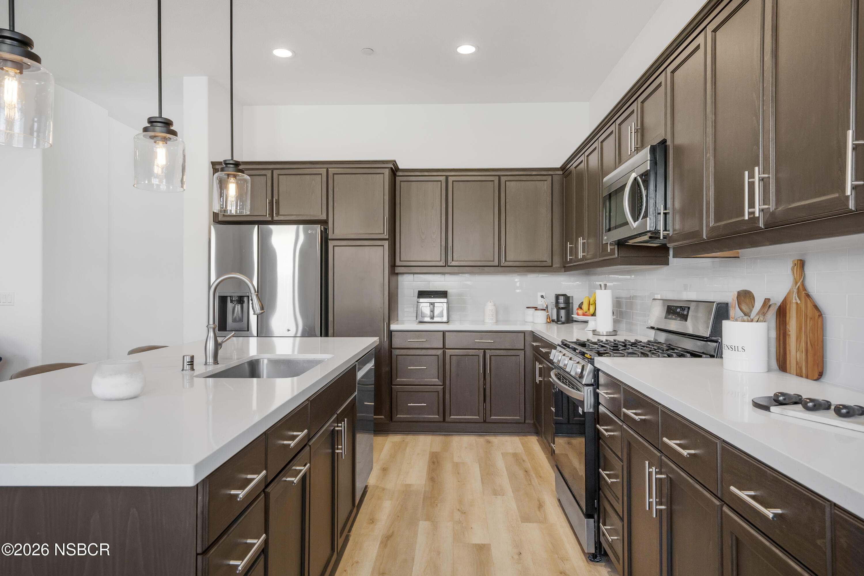 751 Skyview Lane Santa Maria, CA 93455 - Photo 9 of 31 a kitchen with stainless steel appliances granite countertop a sink stove and refrigerator