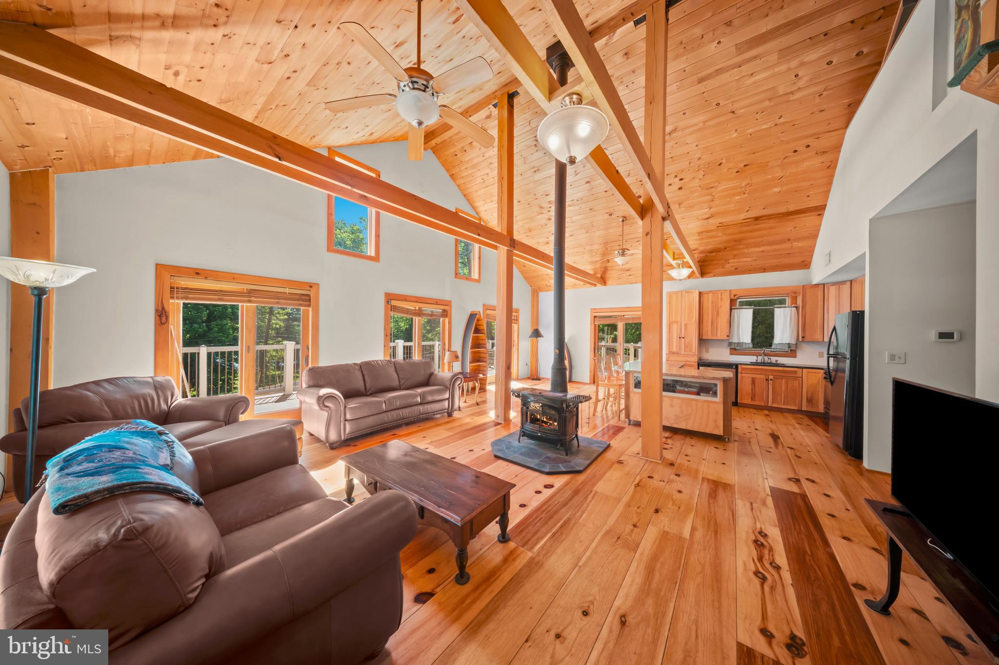 1473 North River Road Yardley, PA 19067 - Photo 21 of 42 a living room with furniture and floor to ceiling windows