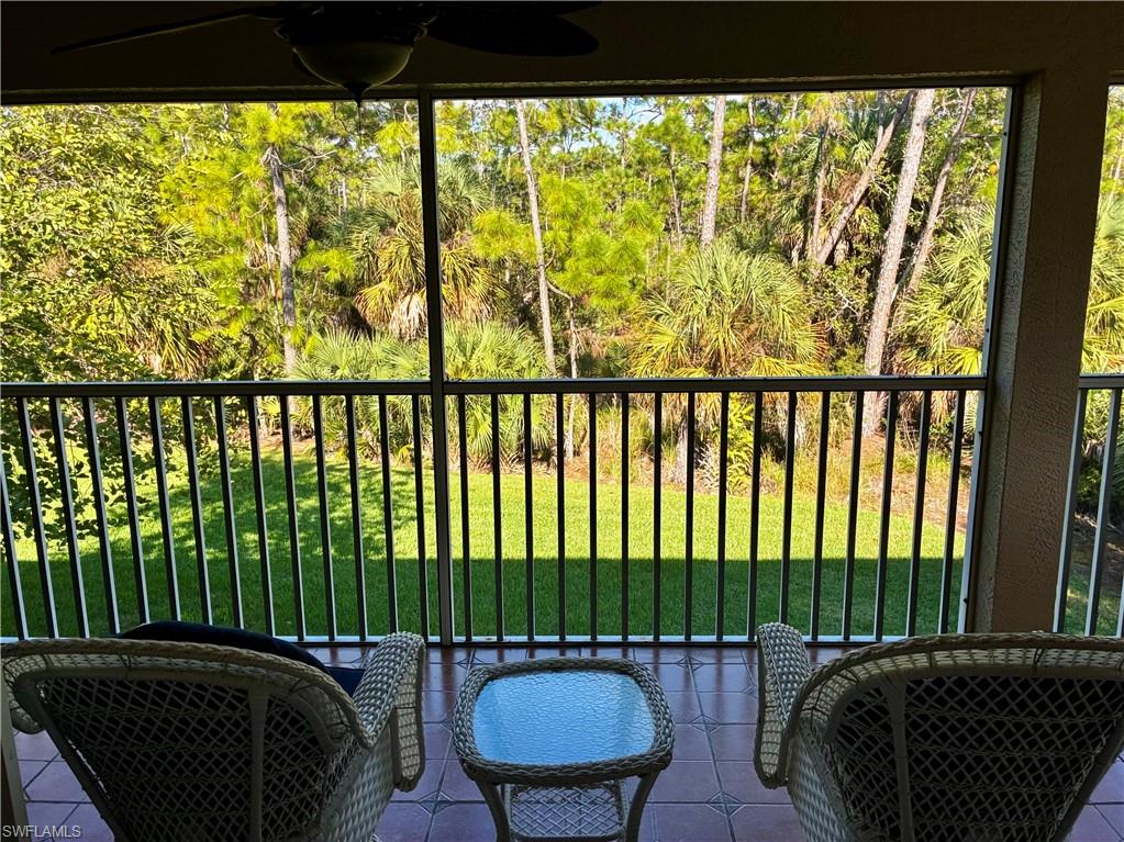 913 Carrick Bend Circle, Unit 202 Naples, FL 34110 - Photo 1 of 44 a view of a black and white bed