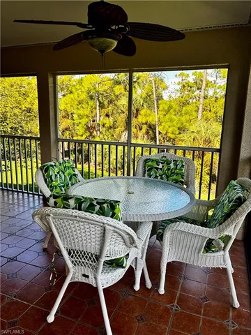 a outdoor dining space with furniture and outdoor view