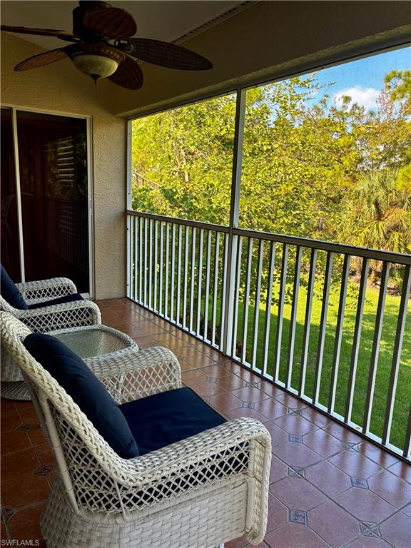 913 Carrick Bend Circle, Unit 202 Naples, FL 34110 - Photo 14 of 44 a view of balcony and furniture