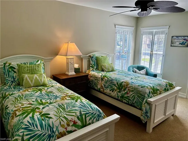 a bedroom with bed and window