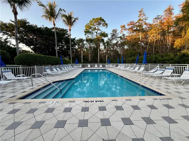 a view of a swimming pool with a patio