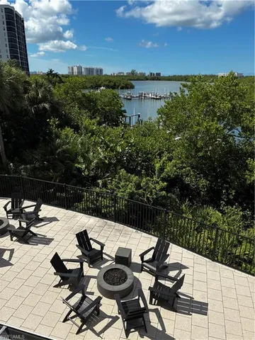 a view of a lake with couches