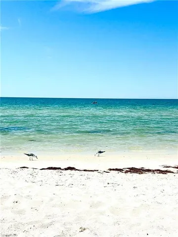 a view of a house with sitting area and garden
