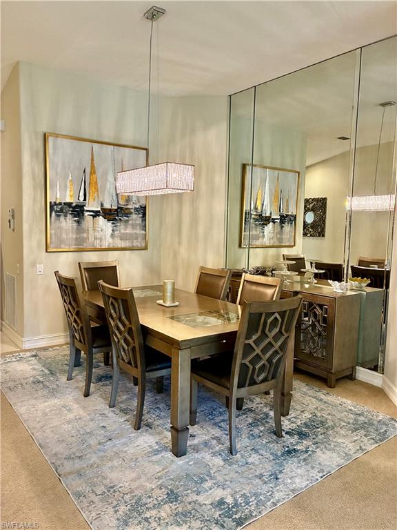 913 Carrick Bend Circle, Unit 202 Naples, FL 34110 - Photo 8 of 44 a view of a dining room with furniture