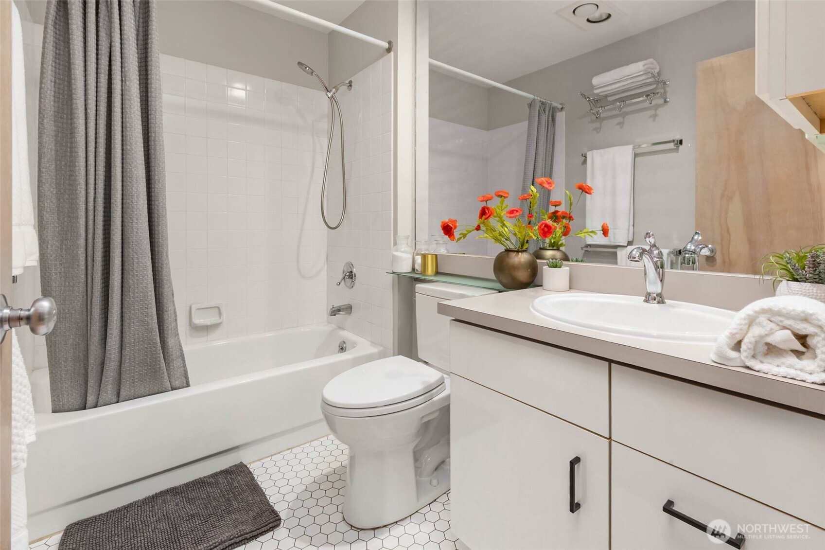 2030 Western Avenue, Unit 701 Seattle, WA 98121 - Photo 14 of 27 a bathroom with a sink toilet and shower