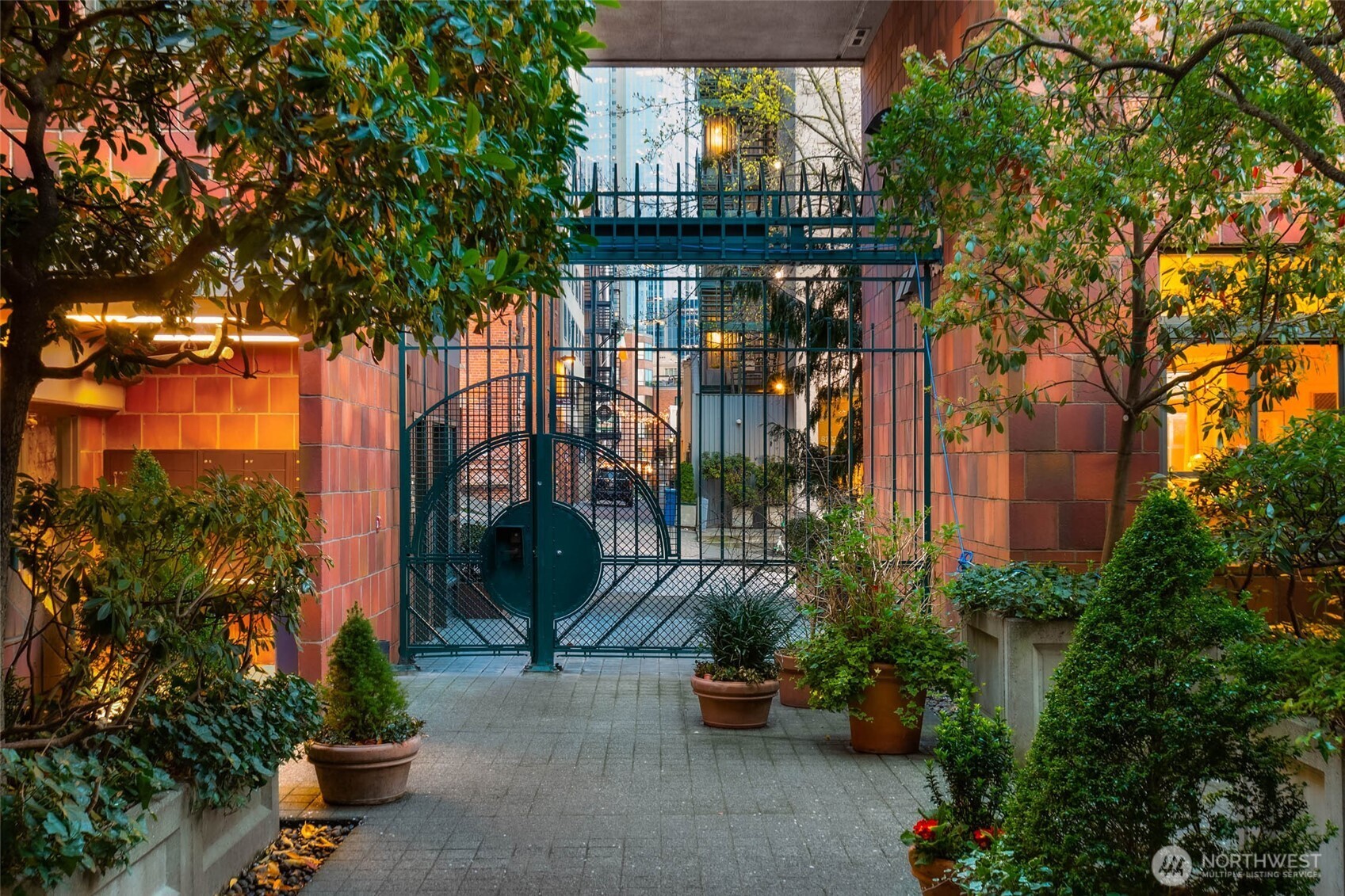2030 Western Avenue, Unit 701 Seattle, WA 98121 - Photo 19 of 27 a front view of a house with a garden