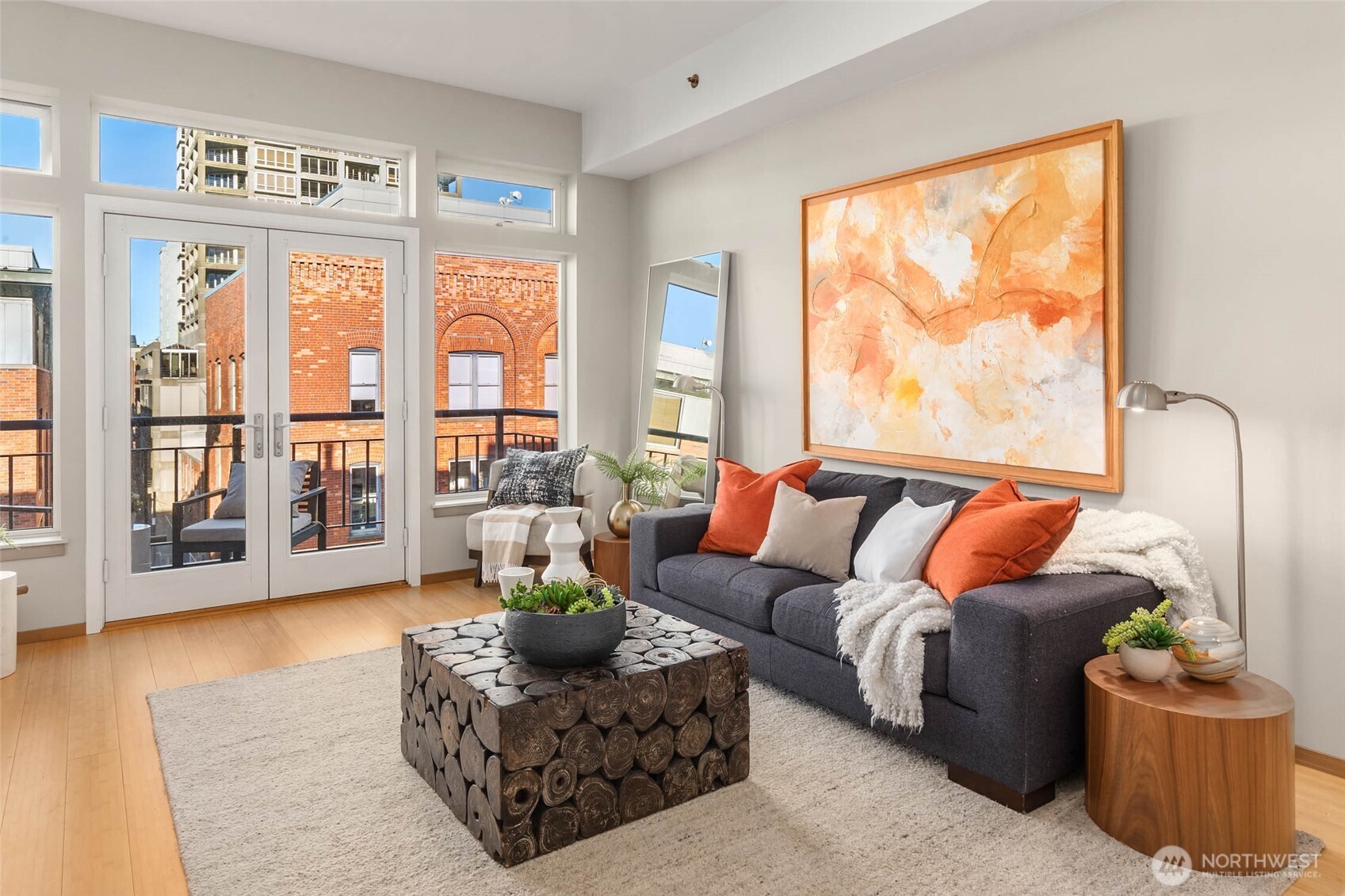 2030 Western Avenue, Unit 701 Seattle, WA 98121 - Photo 7 of 27 a living room with furniture and a large window