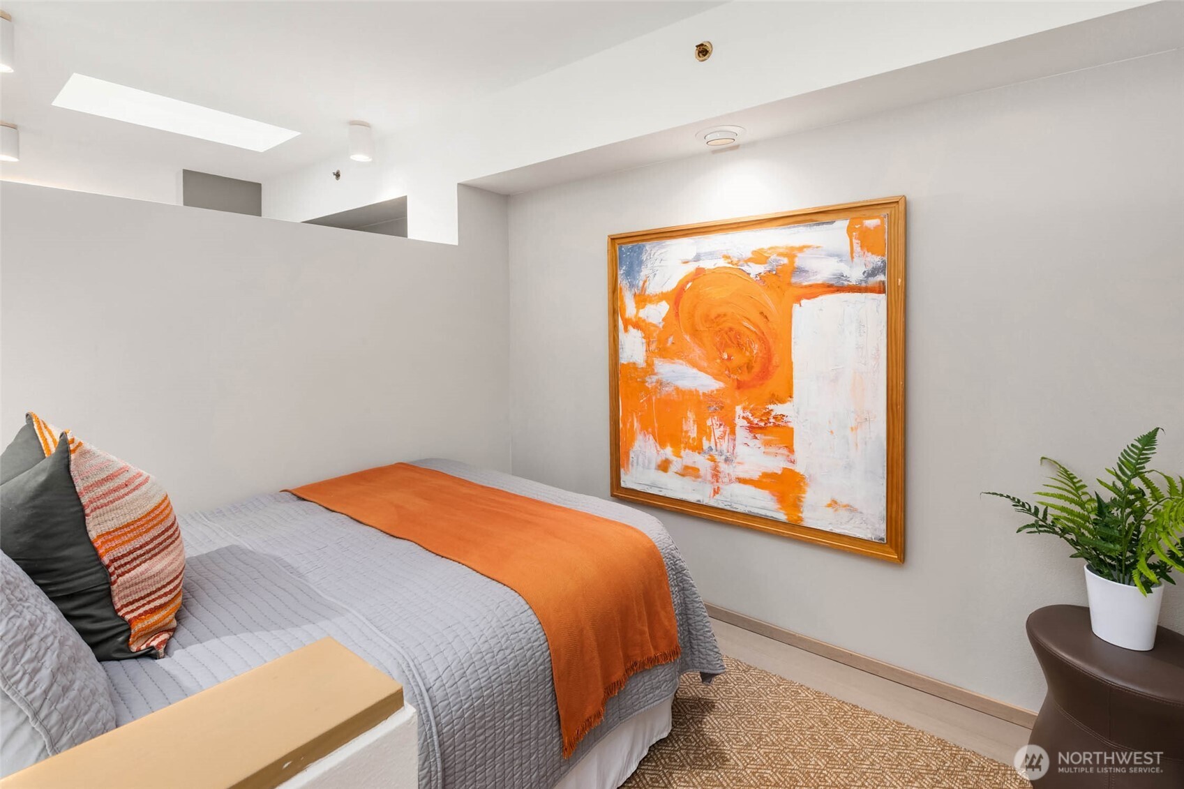 2030 Western Avenue, Unit 701 Seattle, WA 98121 - Photo 9 of 27 a bedroom with a bed and a window