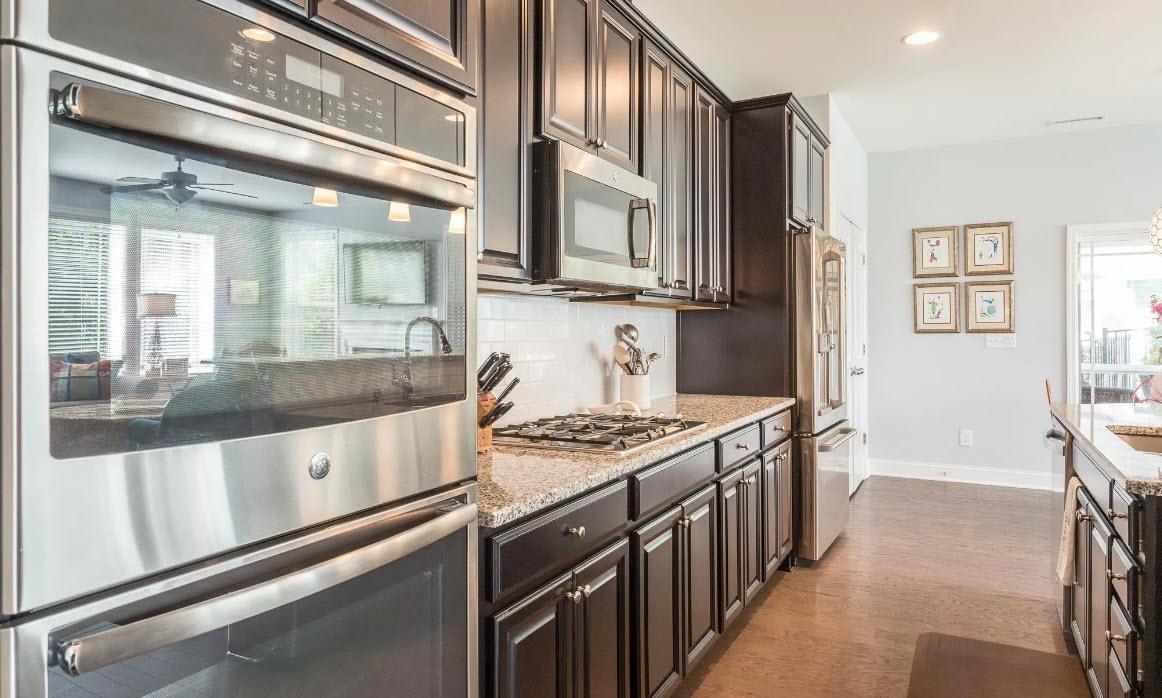 114 Willow View Lane Apex, NC 27539 - Photo 14 of 34 a kitchen with stainless steel appliances granite countertop a stove and a sink