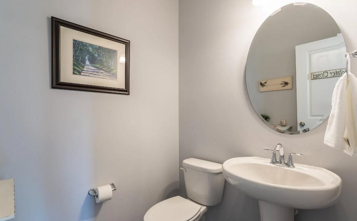 114 Willow View Lane Apex, NC 27539 - Photo 17 of 34 a bathroom with a toilet sink and mirror