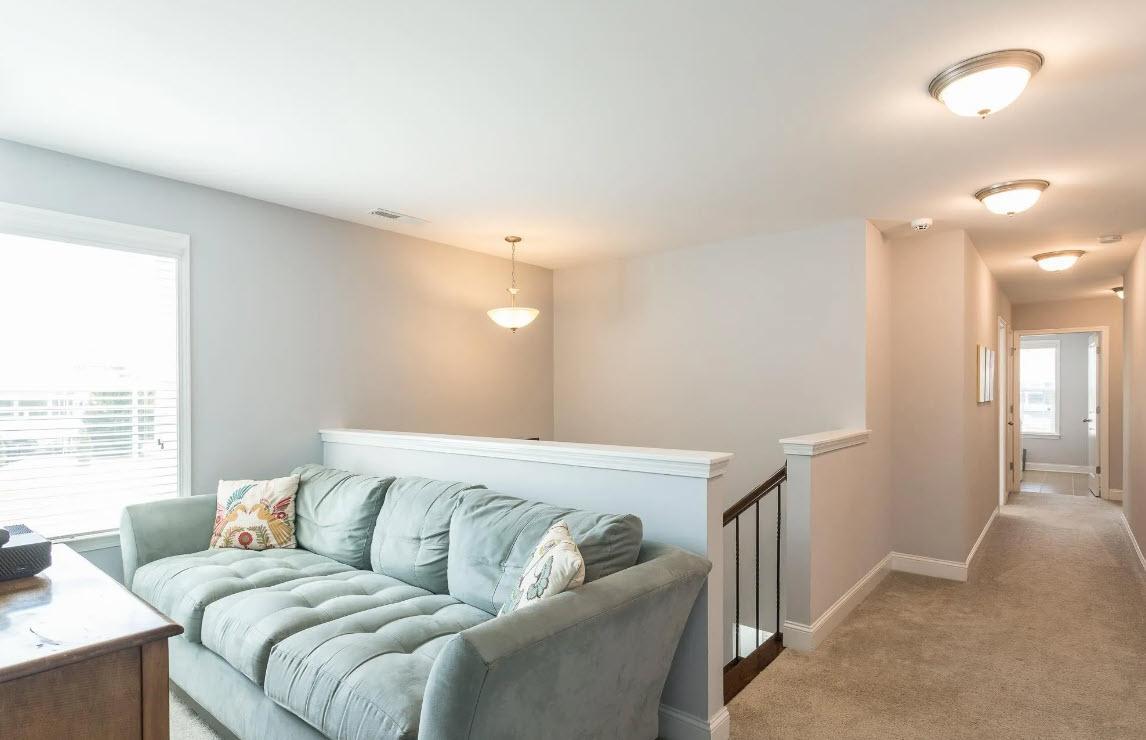 114 Willow View Lane Apex, NC 27539 - Photo 18 of 34 a living room with a couch