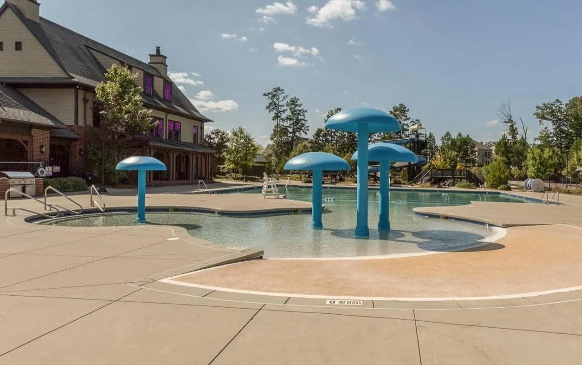 114 Willow View Lane Apex, NC 27539 - Photo 32 of 34 a view of a swimming pool with a table and chairs