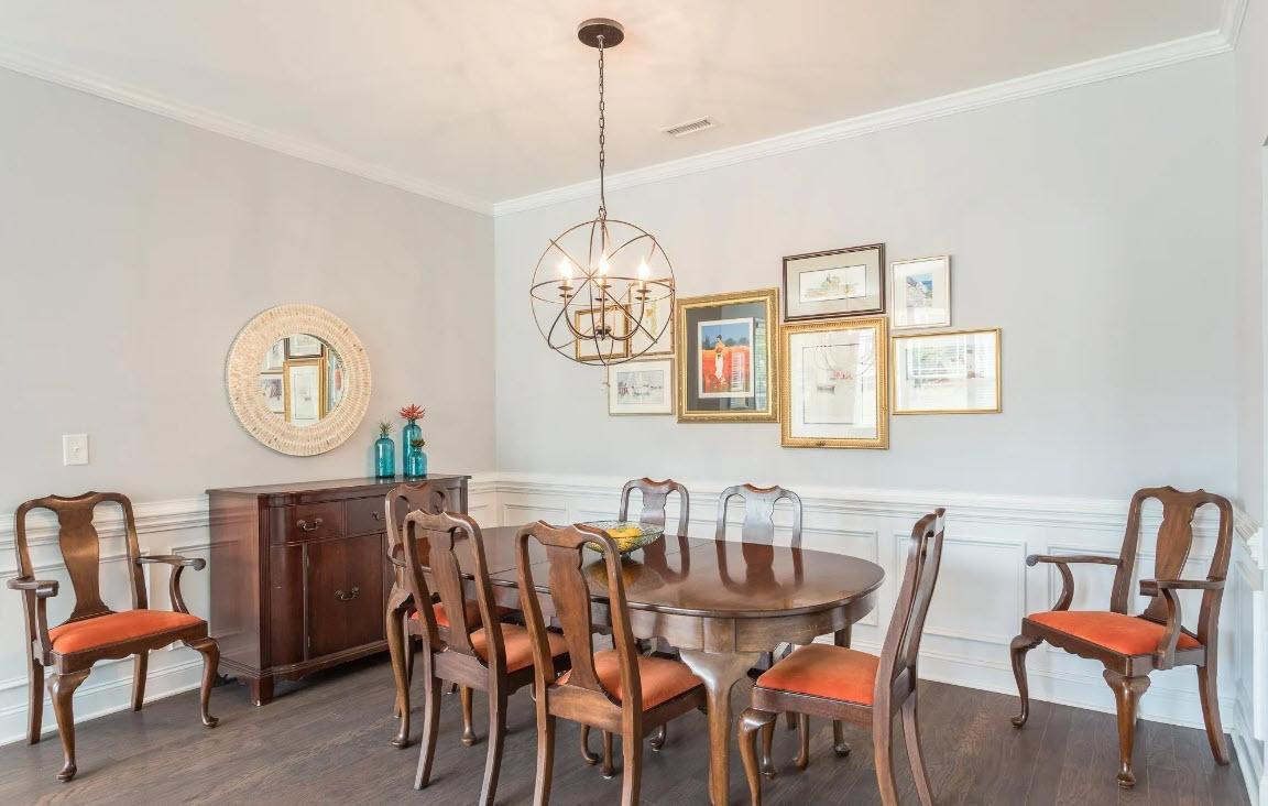 114 Willow View Lane Apex, NC 27539 - Photo 8 of 34 a dining room with furniture a rug and a wooden floor