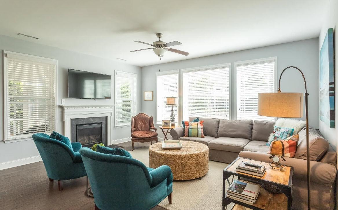 114 Willow View Lane Apex, NC 27539 - Photo 10 of 34 a living room with furniture a fireplace and a flat screen tv