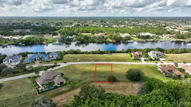 an aerial view of lake residential houses with outdoor space and swimming pool