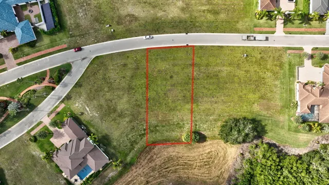 a view of a swimming pool with a yard