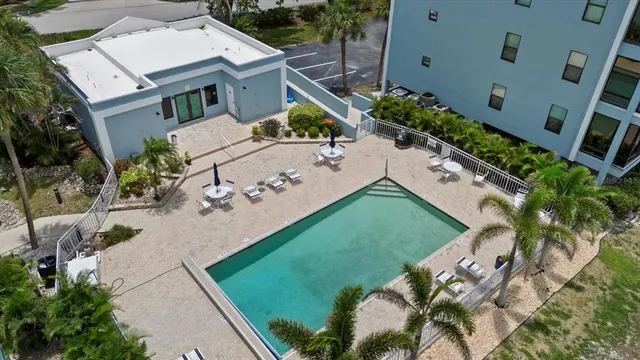 an aerial view of a house with a yard and fountain
